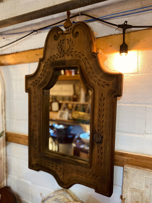 Ornate carved wood mirror